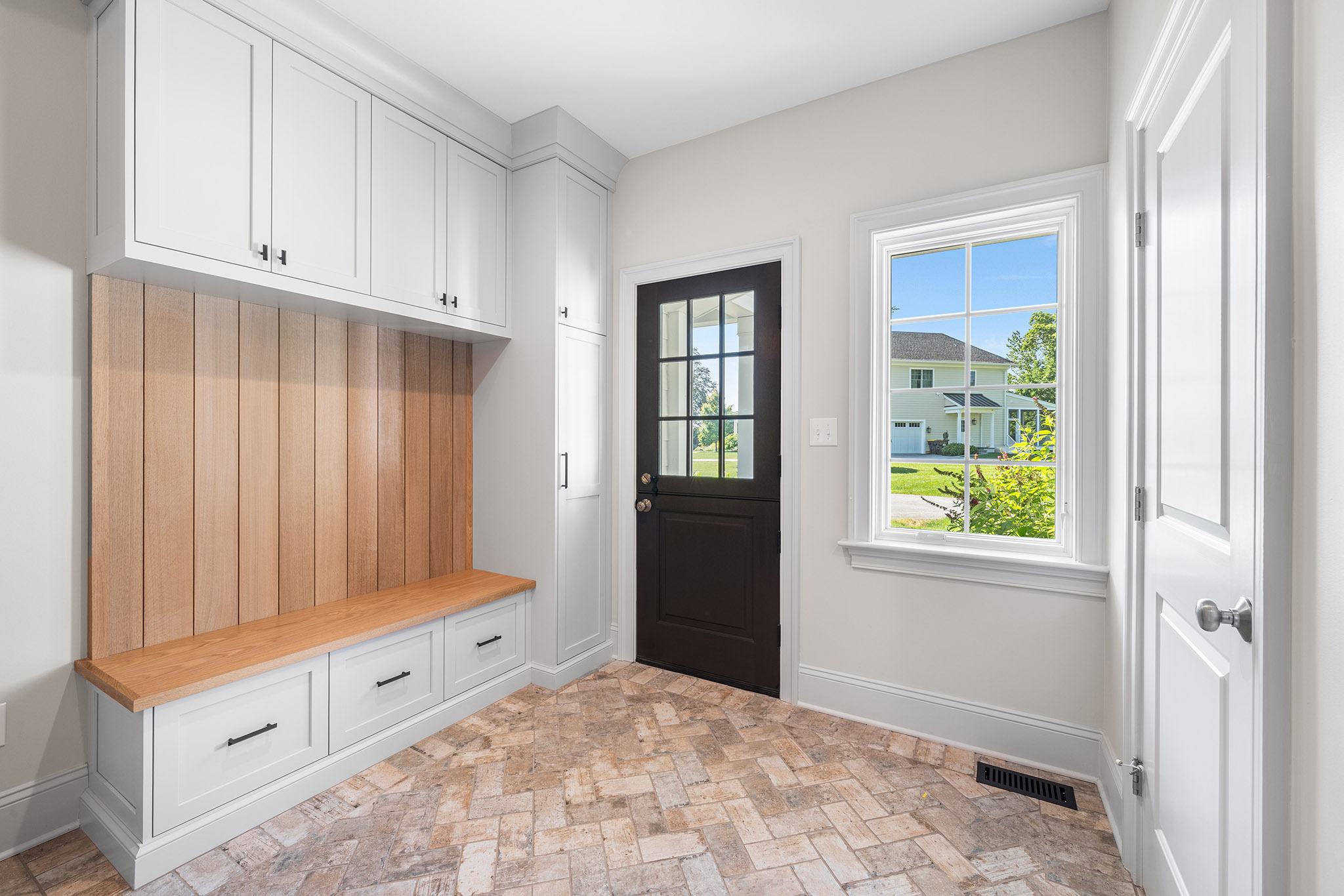 Domers Construction - Integrated and transformed unfinished garage and basement into indoor play area, mudroom, home gym, home brew bar, office, bathroom and bedroom