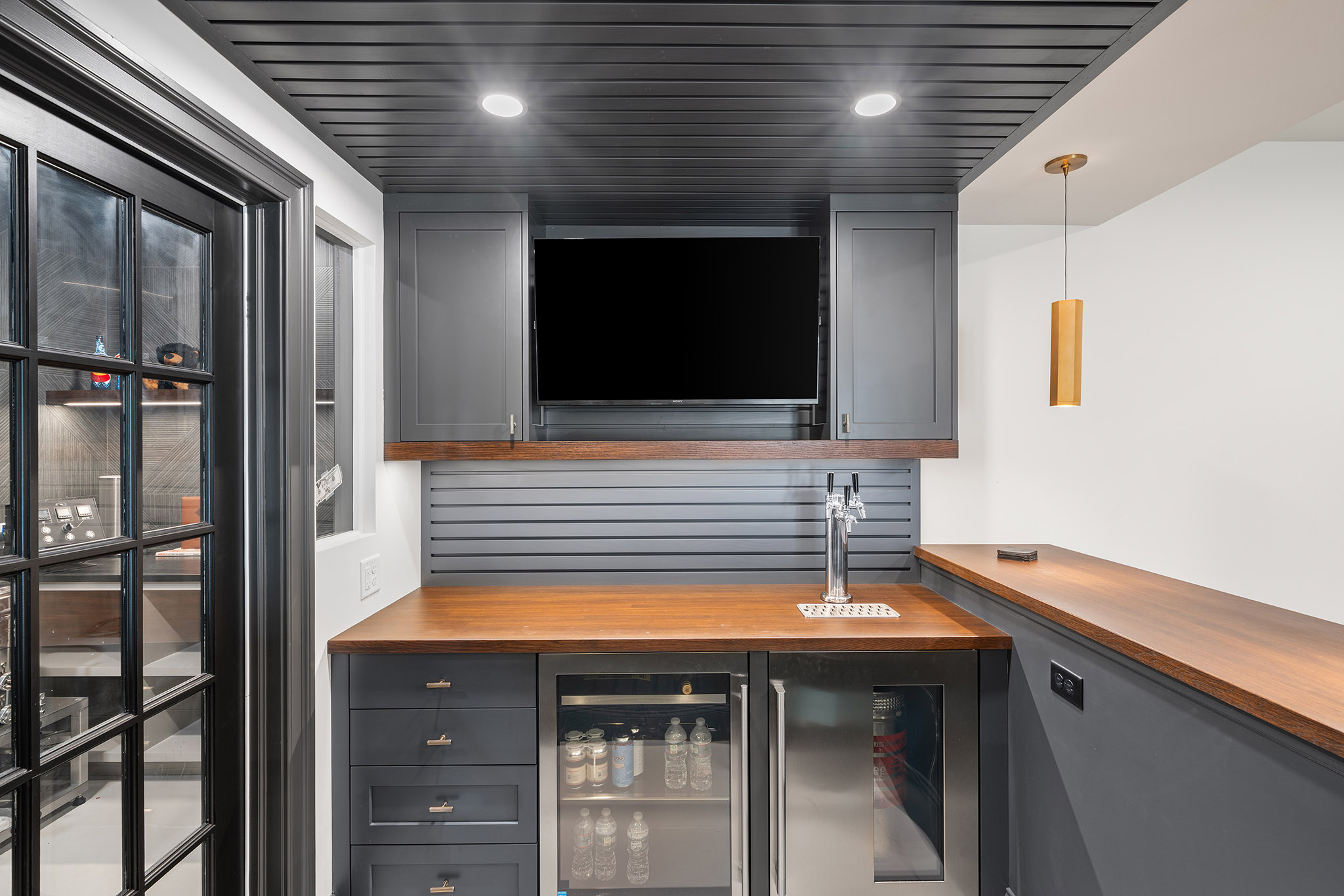 Domers Construction - Integrated and transformed unfinished garage and basement into indoor play area, mudroom, home gym, home brew bar, office, bathroom and bedroom