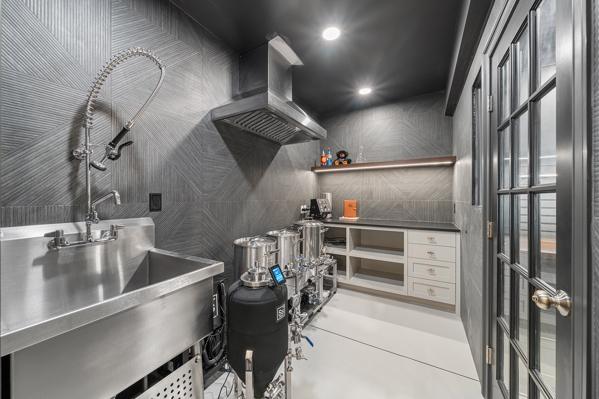 Domers Construction - Integrated and transformed unfinished garage and basement into indoor play area, mudroom, home gym, home brew bar, office, bathroom and bedroom